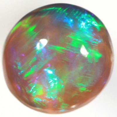 SOLID BLACK CRYSTAL OPAL Rolling flashes of green over purple fire